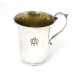 A Continental 925 silver mug with scrolled handle. Marked under in Greek Approx. 3" high Please Note