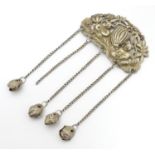 An Oriental white metal pendant / chatelaine with cast figure decoration with gourd detail and