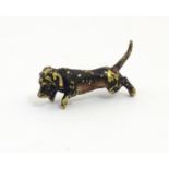 A late 19thC cold painted bronze model of a dachshund / sausage dog. Approx. 1" long Please Note -