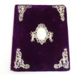 A Victorian desk blotter / stationery folder with a purple velvet covering and applied silver