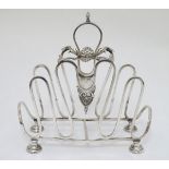 A silver plate toast / letter rack with scroll and shell decoration 7" high x 6 3/4" long Please