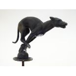 A cast car mascot formed as a model of a greyhound. Approx. 6" long Please Note - we do not make