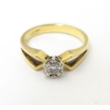 An 18ct gold ring set with diamond solitaire . Ring size approx J Please Note - we do not make