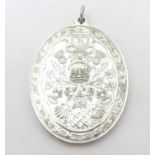 Royal memorabilia : A hallmarked silver commemorative pendant engraved ' Prince Charles & Lady Diana