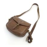 Shooting, sporting collectables: a vintage brown leather shotgun cartridge bag, with shoulder strap,