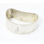 A silver napkin ring of D shape hallmarked Martin Hall & Co Ltd Please Note - we do not make