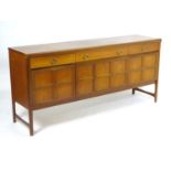 Vintage retro, mid-century: a 1970s teak sideboard by Nathan Furniture, composed of three
