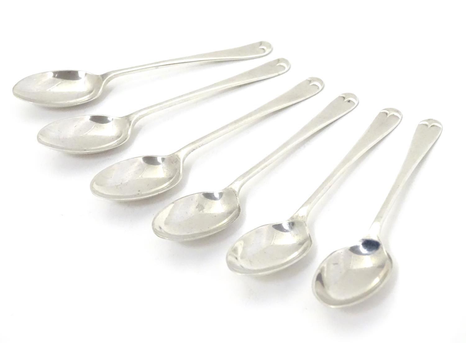 A set of six silver teaspoons with shell decoration to reverse of bowls, hallmarked Sheffield 1956