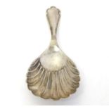 A silver caddy spoon with shell formed bowl, hallmarked Sheffield 1918, maker Atkin Brothers. 3 1/2"
