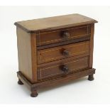 An early 20thC mahogany apprentice piece / miniature chest of drawers, with 3 drawers. Approx. 6 1/