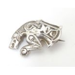 An unusual silver brooch formed as a mythical dragon / horse creature. Possibly Scandinavian 1 1/