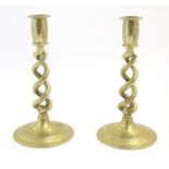 A pair of Victorian brass candlesticks with open twist columns. Approx. 7 3/4" high (2) Please