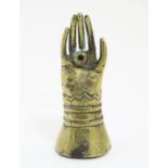 A Victorian novelty brass go-to-bed in the form of an Elizabethan hand and cuff. Approx. 2 7/8" high