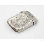 A silver vesta case with engraved decoration. Hallmarked Birmingham 1896 maker JT. 1 1/2" long