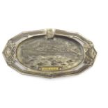 A French 20thC souvenir pin dish for Calais, with an embossed depiction of the steam ferry / liner