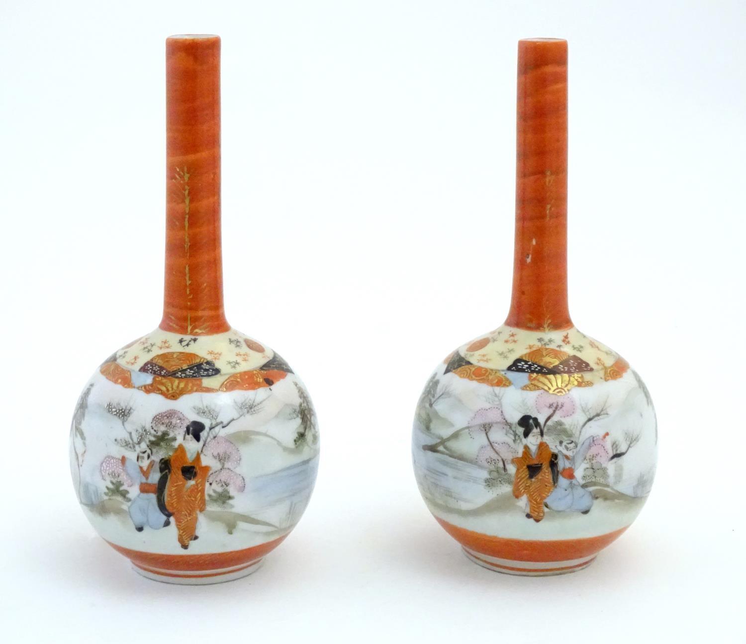 Two Japanese Kutani bottle vases decorated figures in a landscape scenes. Character marks under. - Image 4 of 7