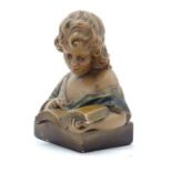 A 20thC French plaster figure with polychrome decoration modelled as a young girl reading. Stamped