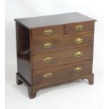 An 18thC mahogany chest of drawers with a rectangular moulded top above two short over three long