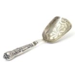 A caddy spoon with shovel formed bowl hallmarked Birmingham c1827 maker IT. 4" long Please Note - we