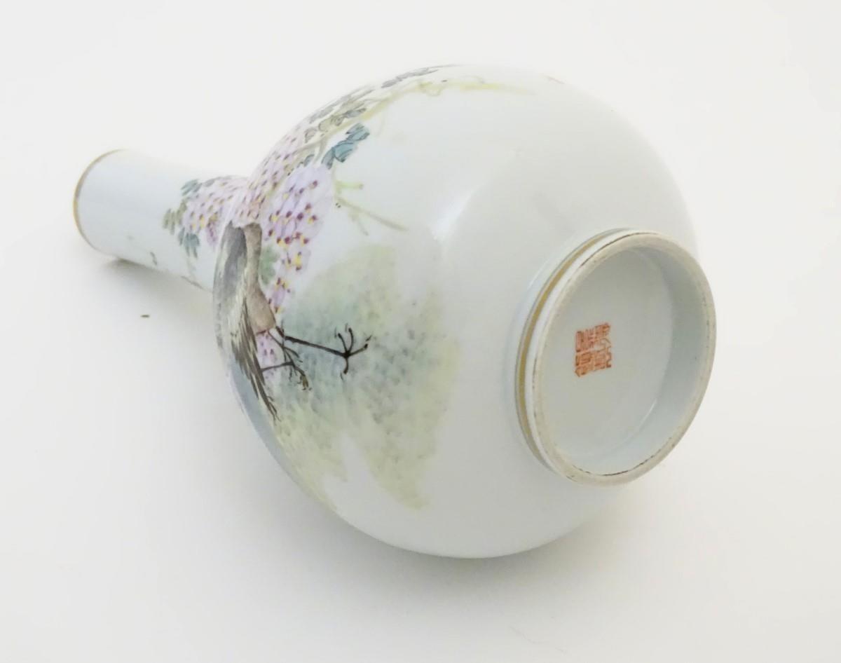 A Chinese globular vase with an elongated neck decorated with peacocks and flowers in a landscape, - Image 6 of 6