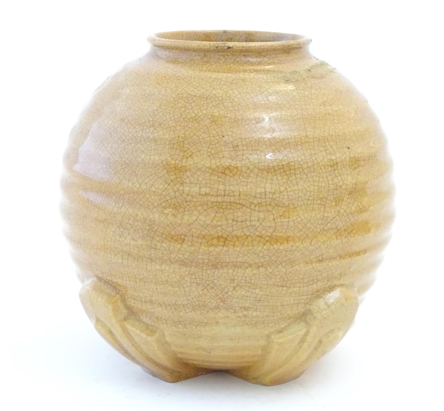An Art Deco globular vase with ribbed decoration. Approx. 7" high Please Note - we do not make