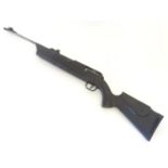 Air rifle: a Umarex 850 air magnum .22 CO2 bolt action airgun, 23 3/4 barrel fitted with open