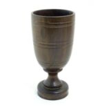 An early 20thC treen turned goblet with banded detail, possibly laburnum. Approx. 6 3/4" high Please