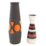 Two West German vases comprising a tall slender example, and a slim vase with a flared rim and