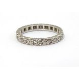 A white gold eternity ring set with band of diamonds. Ring size approx M 1/2 Please Note - we do not