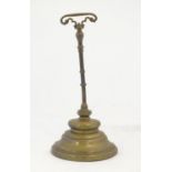 A late 19thC brass door stop. Approx. 13" high Please Note - we do not make reference to the
