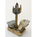 20thC Lion shop balance scales, by Herbert & Son, with enamelled shield shaped badge surmounted by