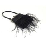 An early 20thC handbag / purse with beadwork detail and feather fringing. Approx. 8" x 5 1/2" Please