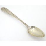 An Irish silver Star/ Celtic Point Pattern teaspoon. Hallmarked Dublin maker John Smyth, and stamped