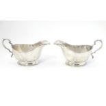 A pair of silver sauce boats hallmarked Birmingham 1933 maker Mappin & Webb Ltd. 6 1/4" long