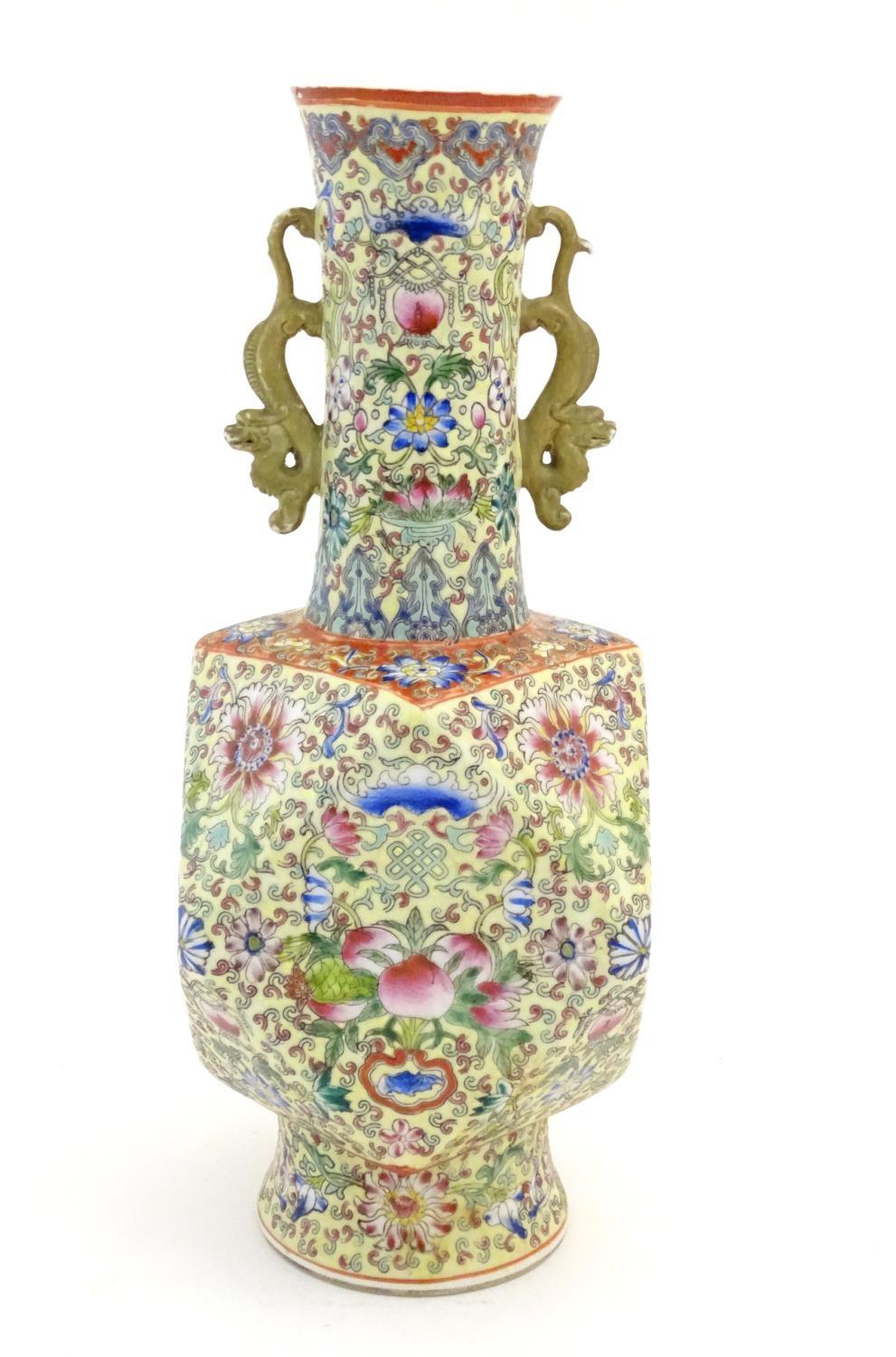 A Chinese famille jaune vase with twin handles modelled as stylised dragons, the body decorated with - Image 3 of 7