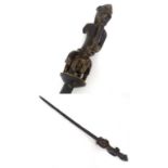 Ethnographic / Native / Tribal: An African carved hardwood ceremonial staff with figural detail,