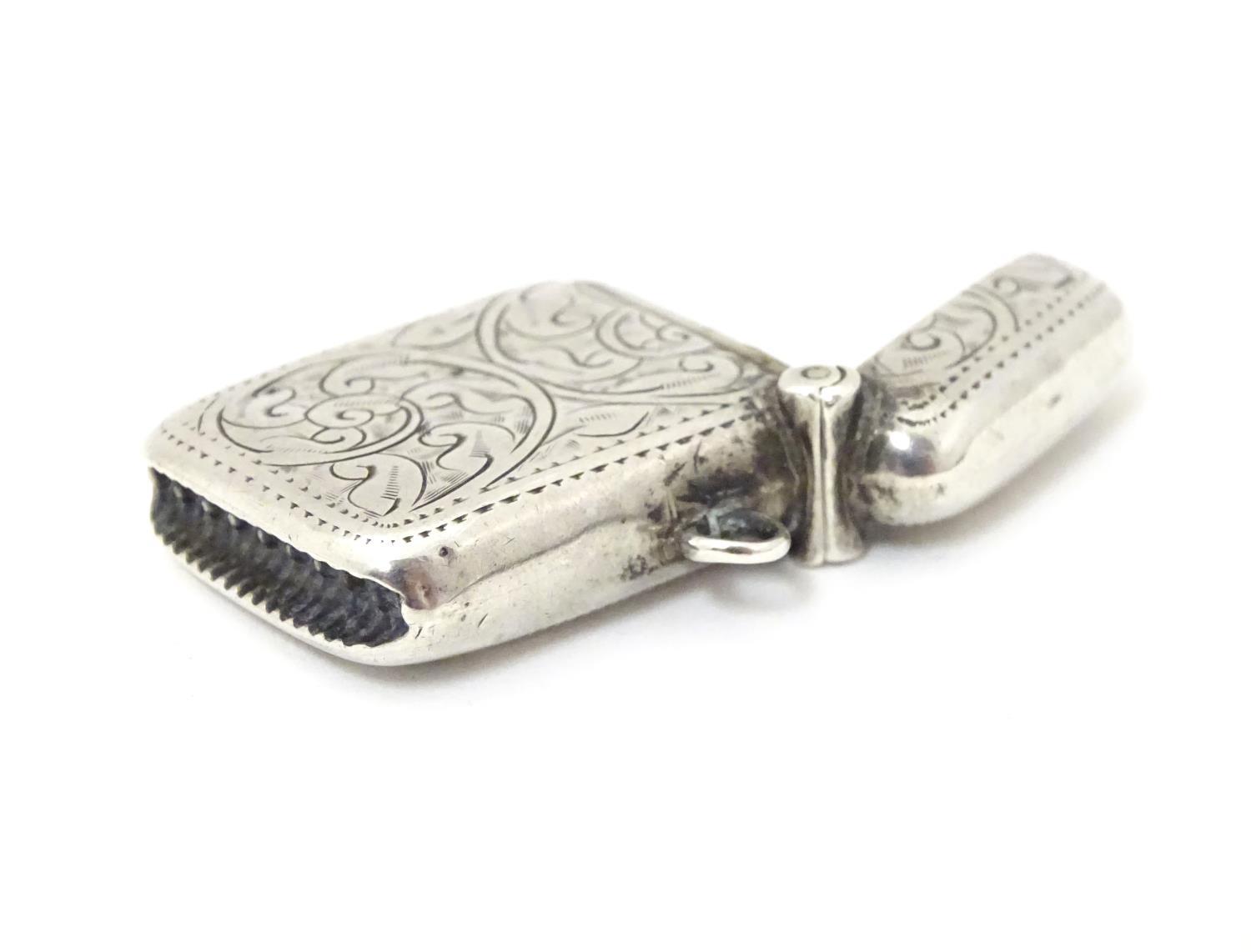 A silver vesta case with engraved decoration. Hallmarked Birmingham 1913 maker Joseph Gloster Ltd. 1 - Image 2 of 5