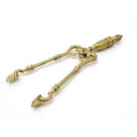 Victorian brass fire tongs with flame finial. Approx. 17" long Please Note - we do not make