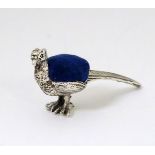 A novelty white metal pin cushion formed as a pheasant 2'' long Please Note - we do not make