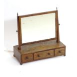 A 19thC mahogany toilet mirror with a rectangular surround above three short drawers. 21" wide x