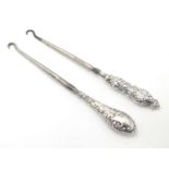 Two silver handled button hooks, one with Art Nouveau decoration hallmarked Birmingham 1912 maker