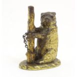 A 19thC brass go to bed vesta case formed as a bear and tree trunk. Approx. 3" high Please Note - we