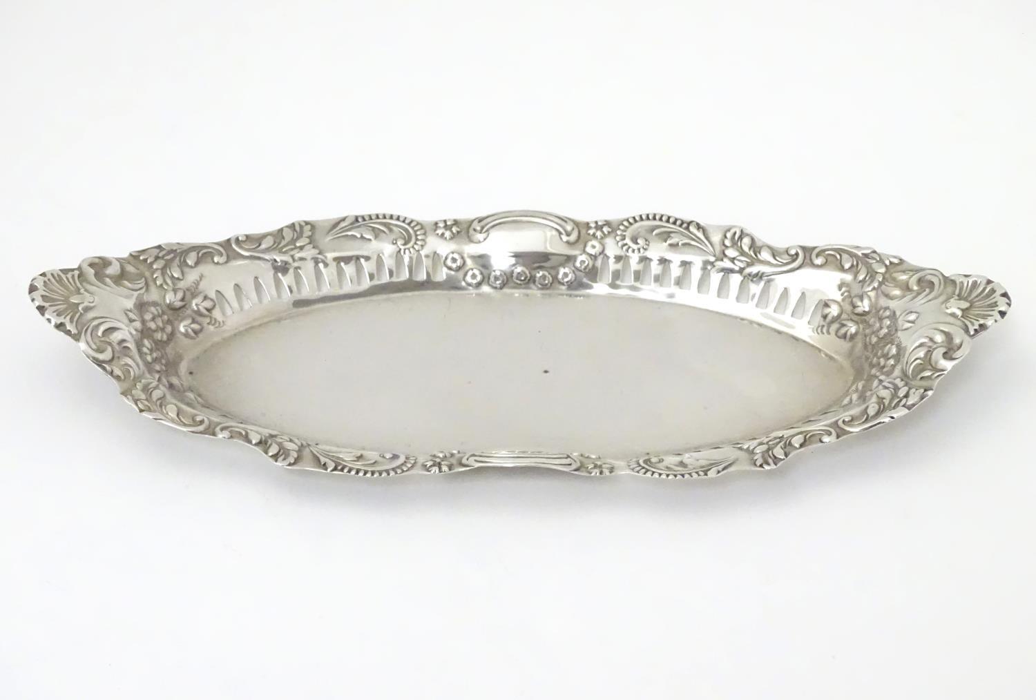 A silver dish of oval form with pierced and embossed decoration , hallmarked Birmingham 1899 maker - Image 4 of 6