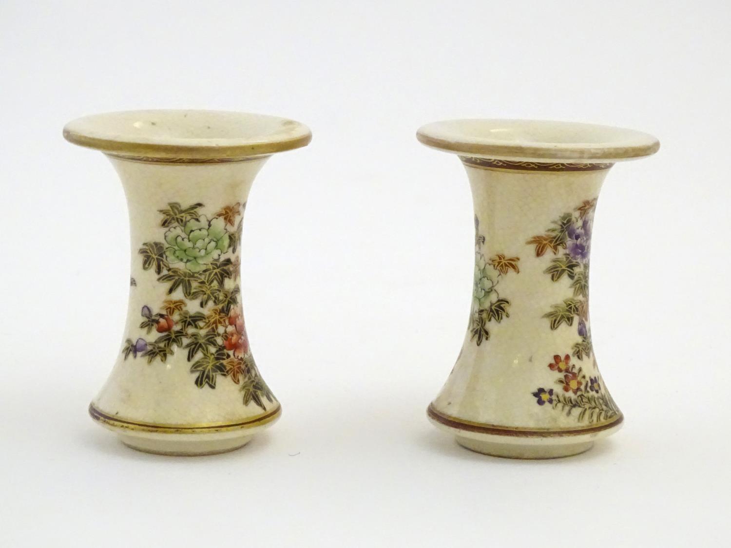 A pair of Japanese miniature Satsuma vases with flared rims and bases, decorated with flowers and - Image 4 of 8