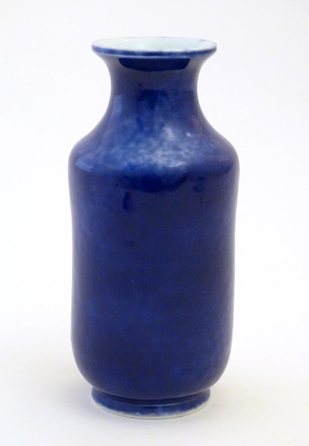 A Chinese vase with a flared rim with a cobalt blue ground. Approx. 7 3/4" high Please Note - we