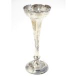 A silver bud vase, hallmarked Chester 1915. 7" high Please Note - we do not make reference to the