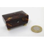 A 19thC blond tortoiseshell snuff box with hinged lid and squat bun feet. Approx. 2" wide Please