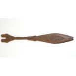 Ethnographic / Native / Tribal: A carved wooden ceremonial paddle formed as a stylised fish with