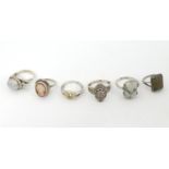 6 assorted silver and white metal rings, one with cameo detail another with agate. (6) Please Note -