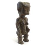 Ethnographic / Native / Tribal: A carved African figure. Approx. 13" high Please Note - we do not
